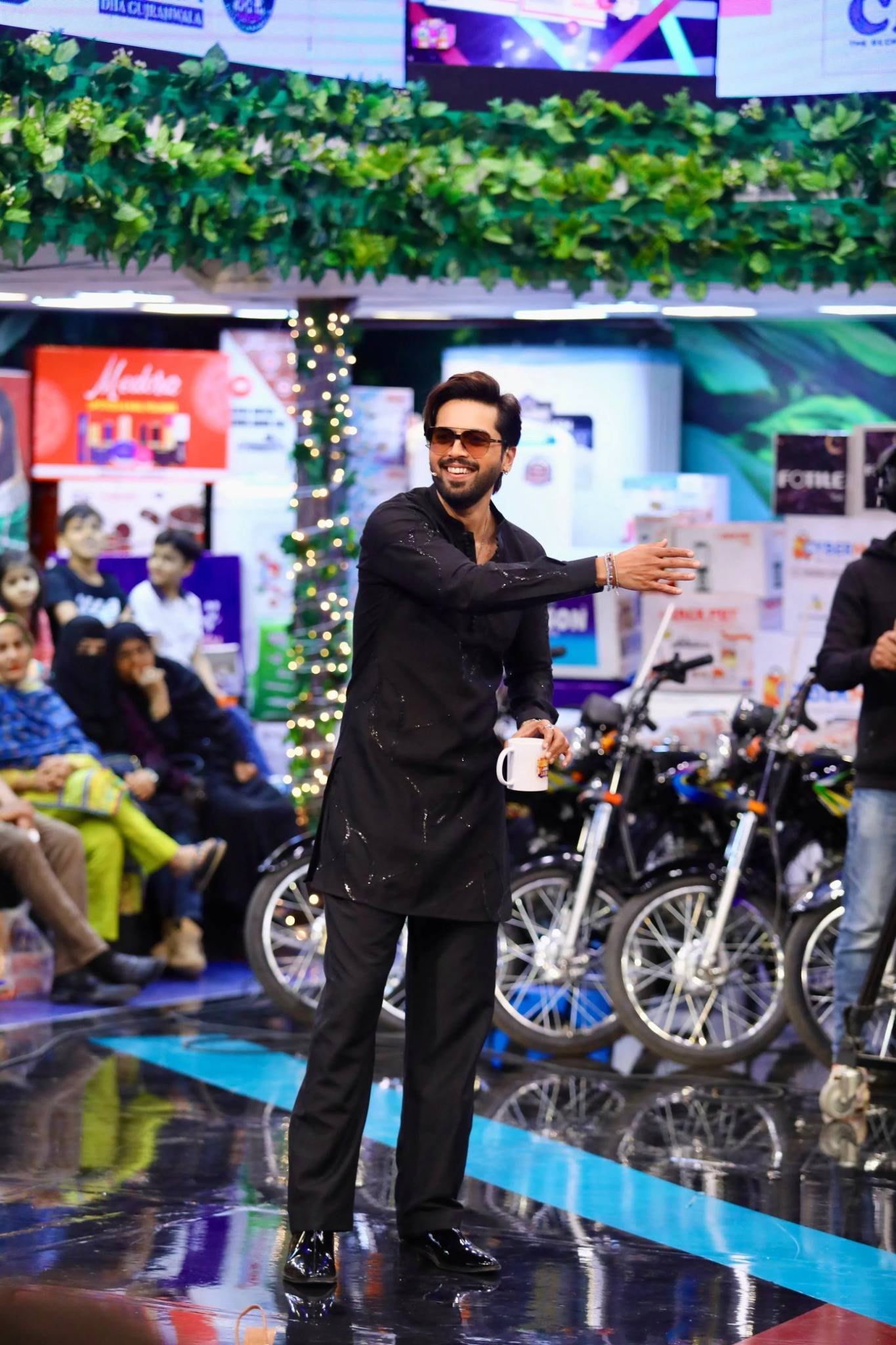 Fahad Mustafa wearing Snug black sequin kurta trouser set for men premium Pakistani festive wear