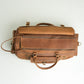 Leather duffel bag.