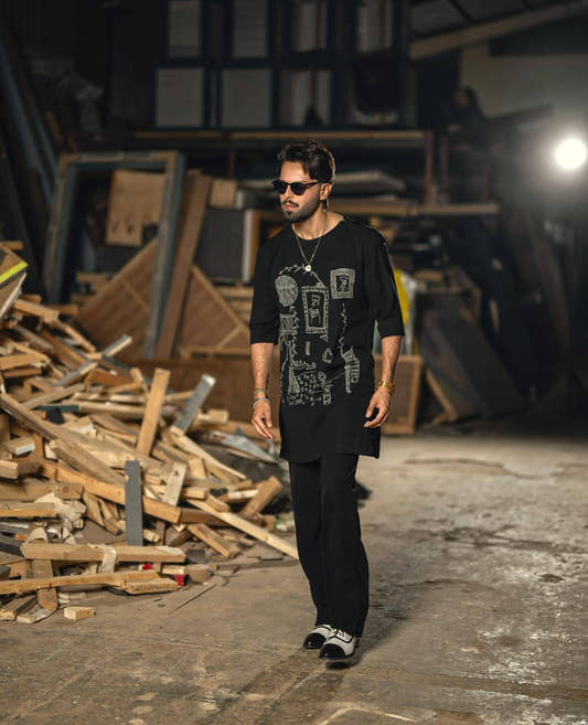 Fahad Mustafa wearing Snug luxe loose fit black kurta trouser for men premium Pakistani ethnic wear