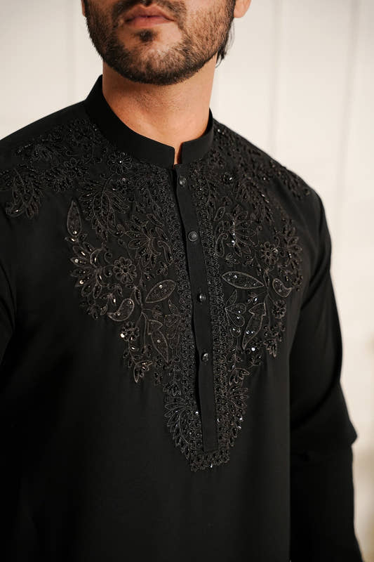 Close up hand embroidery detail on black kurta by Snug Italian georgette