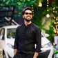 Fahad Mustafa wearing Snug black sequin kurta trouser set for men premium Pakistani festive wear