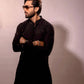 Fahad Mustafa wearing Snug black sequin kurta trouser set for men premium Pakistani festive wear