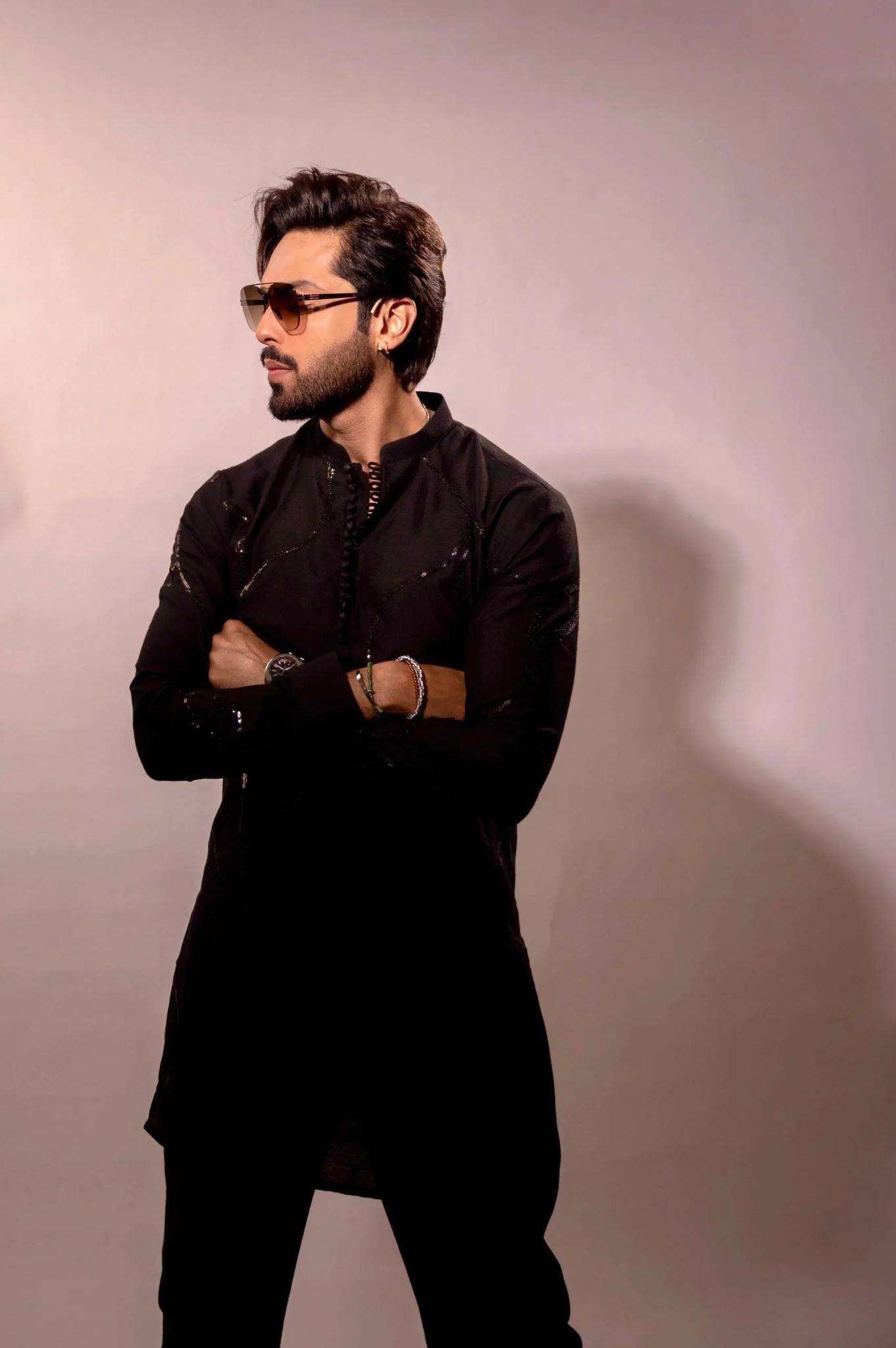 Fahad Mustafa wearing Snug black sequin kurta trouser set for men premium Pakistani festive wear