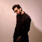 Fahad Mustafa wearing Snug black sequin kurta trouser set for men premium Pakistani festive wear