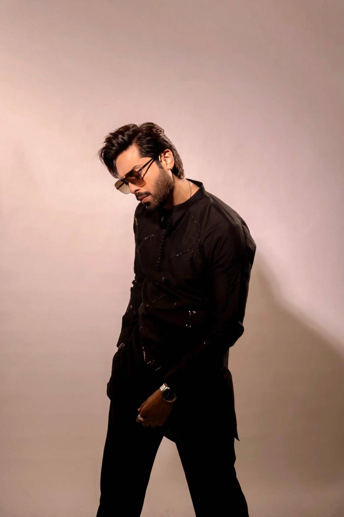 Fahad Mustafa wearing Snug black sequin kurta trouser set for men premium Pakistani festive wear