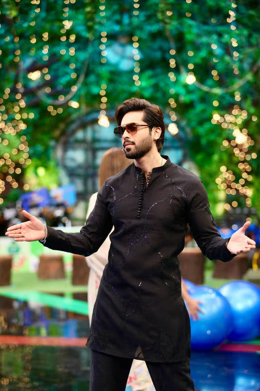 Fahad Mustafa wearing Snug black sequin kurta trouser set for men premium Pakistani festive wear