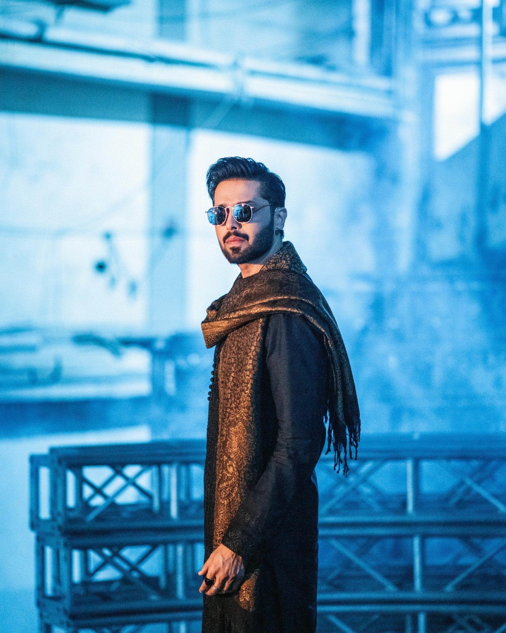 Fahad Mustafa wearing Snug black farshi outfit for men with embroidered shawl premium ethnic wear