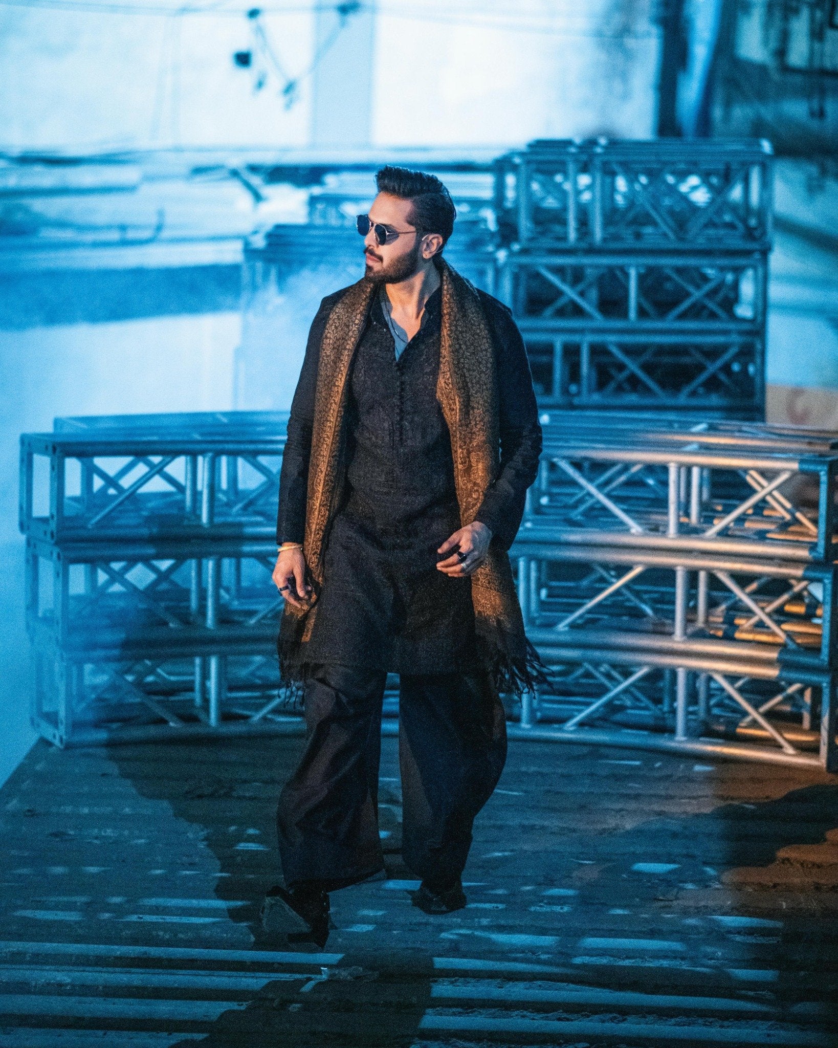 Fahad Mustafa wearing Snug black farshi outfit for men with embroidered shawl premium ethnic wear