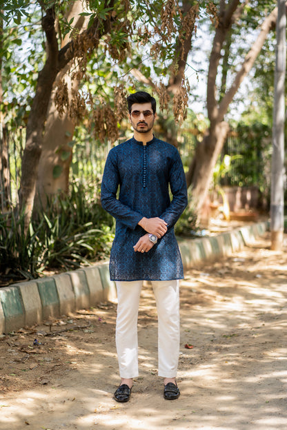 Needlework Marvels: Snug's Exclusive Embroidered Kurta Trouser Series.