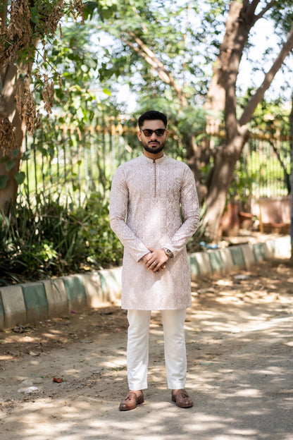 Needlework Marvels: Snug's Exclusive Embroidered Kurta Trouser Series.